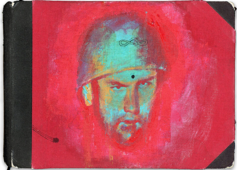 Painted sketchbook cover featuring a stylized male face in turquoise and yellow tones against a vivid red background, with worn edges and visible canvas texture.